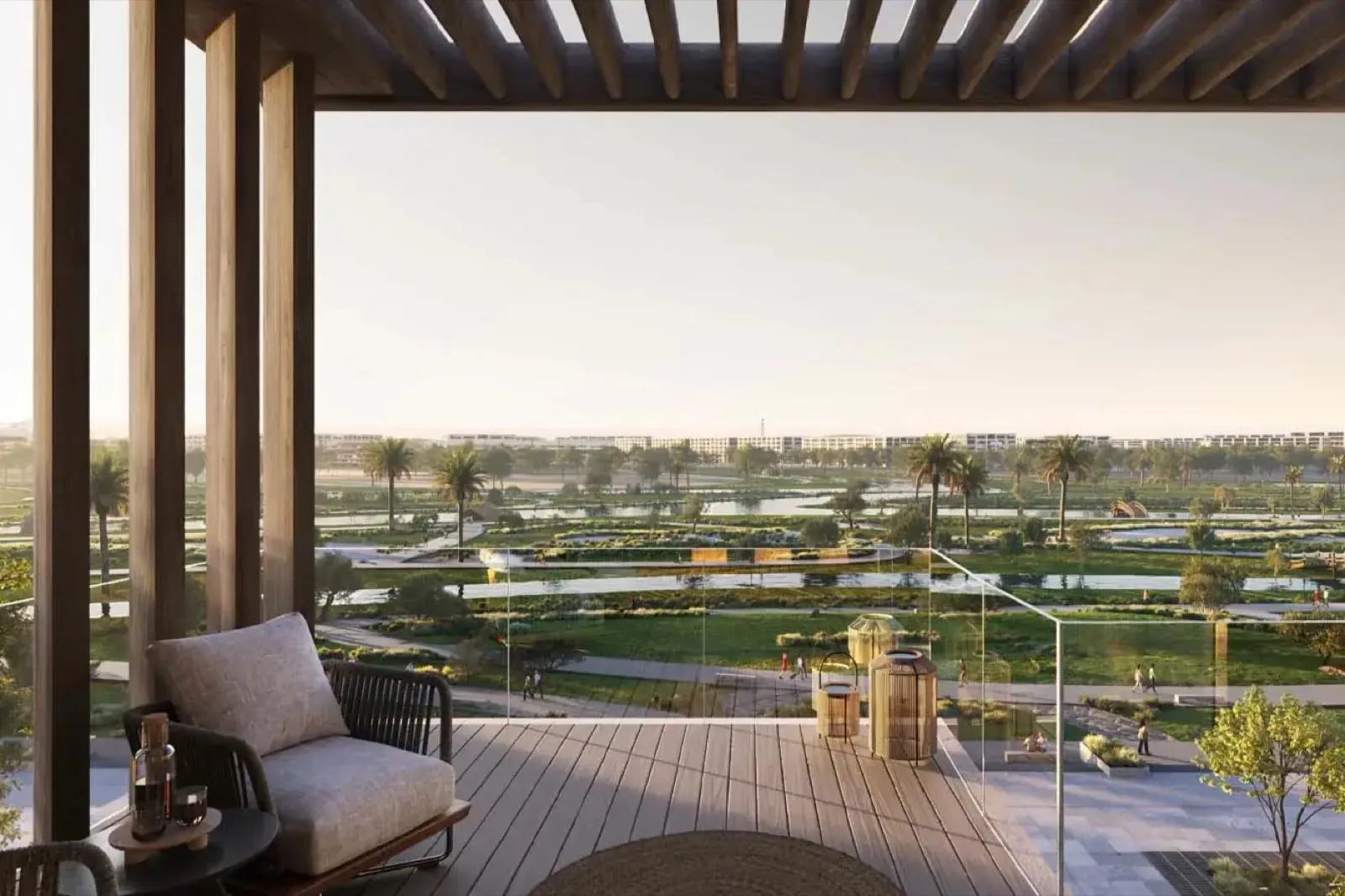 Architect's rendering from Wadi Zaha in Sultan Haitham City: a shaded timber terrace looking over a landscaped wadi park with water channels and palms