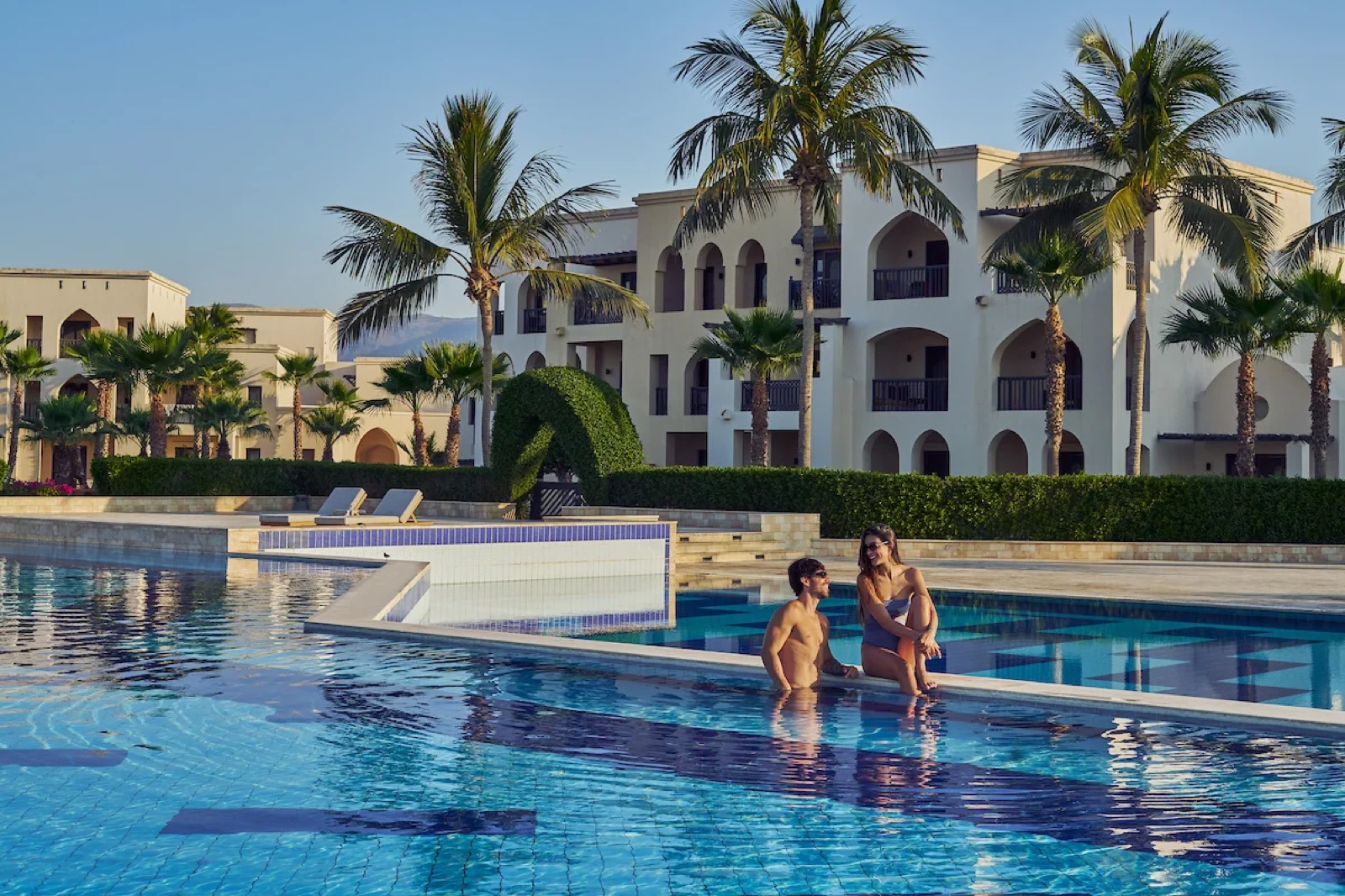 Pool and residences at Hawana Salalah beachfront community in Oman